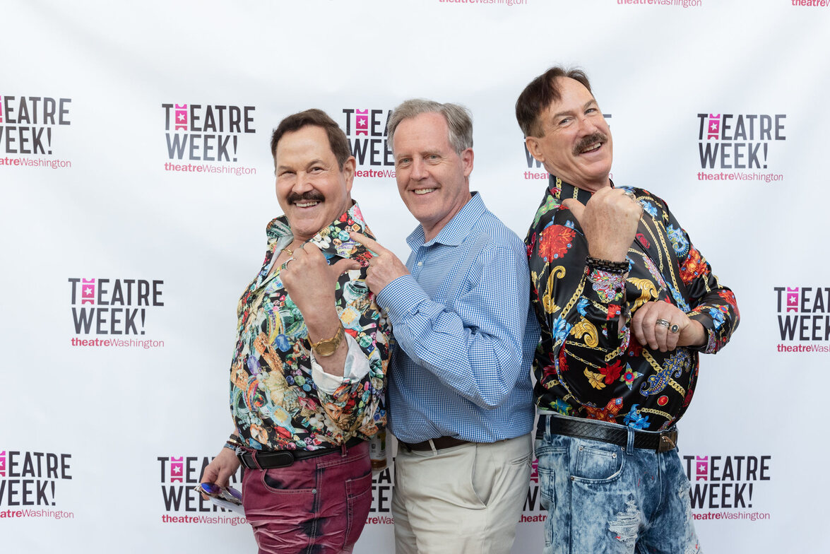 three men in front of a theatre week backdrop