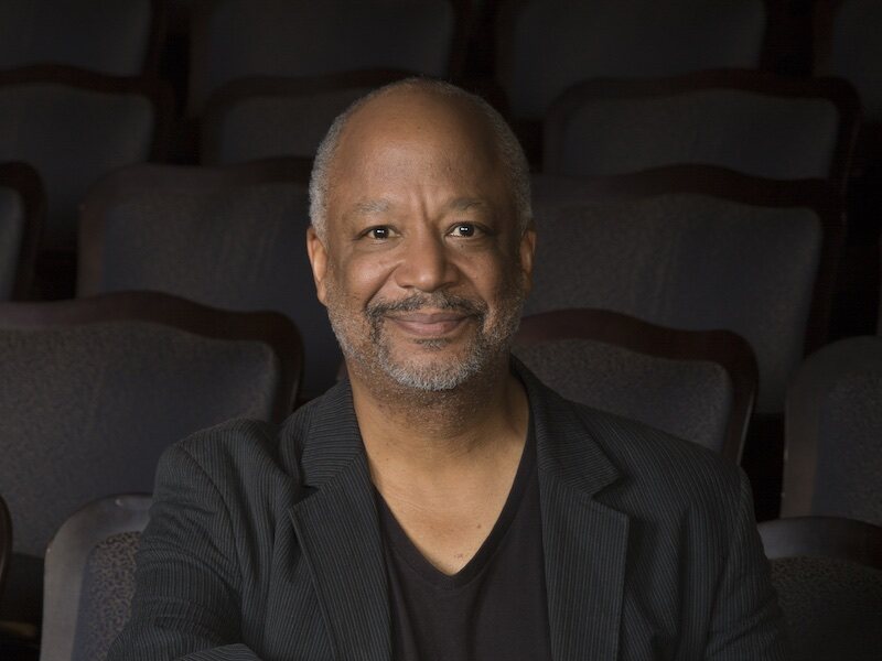 Director Sheldon Epps photographed in theater seating.